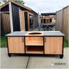 Buitenkeuken industrieel Den Haag met Douglas hout, mat zwart staal en twee keramische tegels